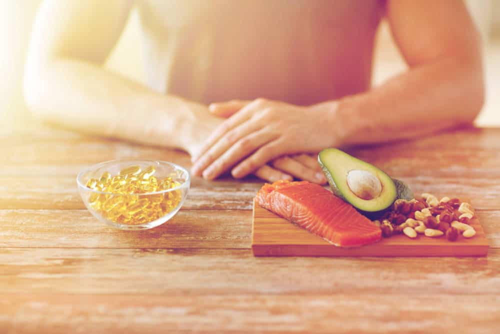 Fish oil capsules and avocados and fish.