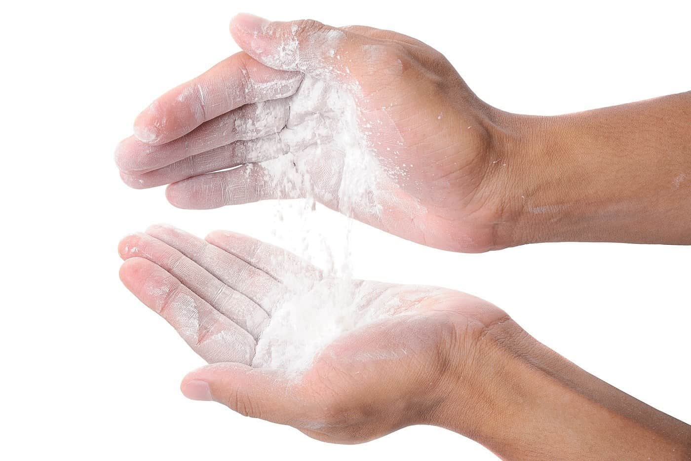 A person with baby powder on his hands.